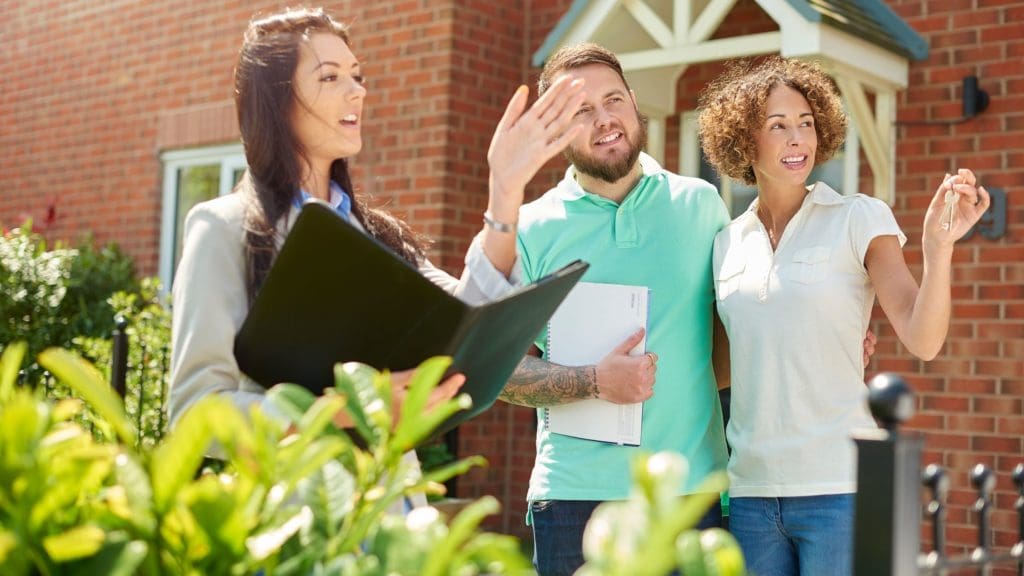 A Realtor is presenting a property to potential home buyers