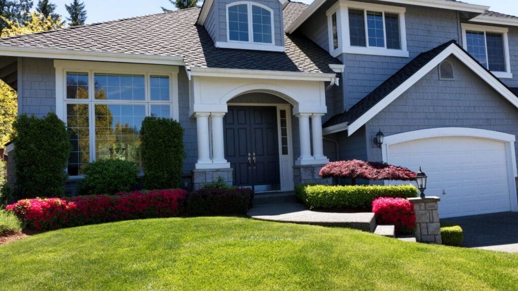 A house with a well-maintained garden and a freshly painted front door