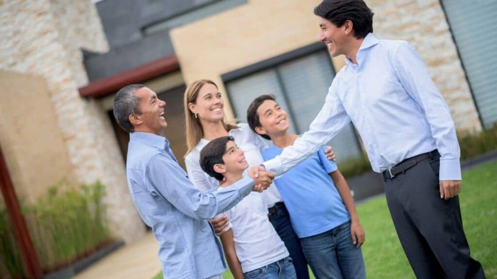 A family looking at a house with a real estate agent