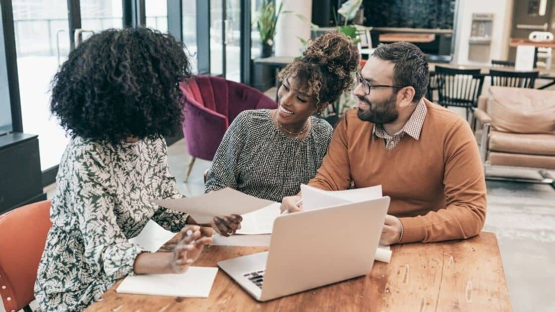 A family discussing mortgage options and pre-approval with a mortgage broker